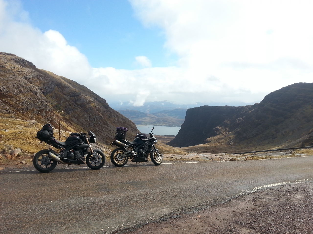 Top of the Bealach Na Ba, on the way to Applecross, with Big Ian. Mr Orange is wimping out at...