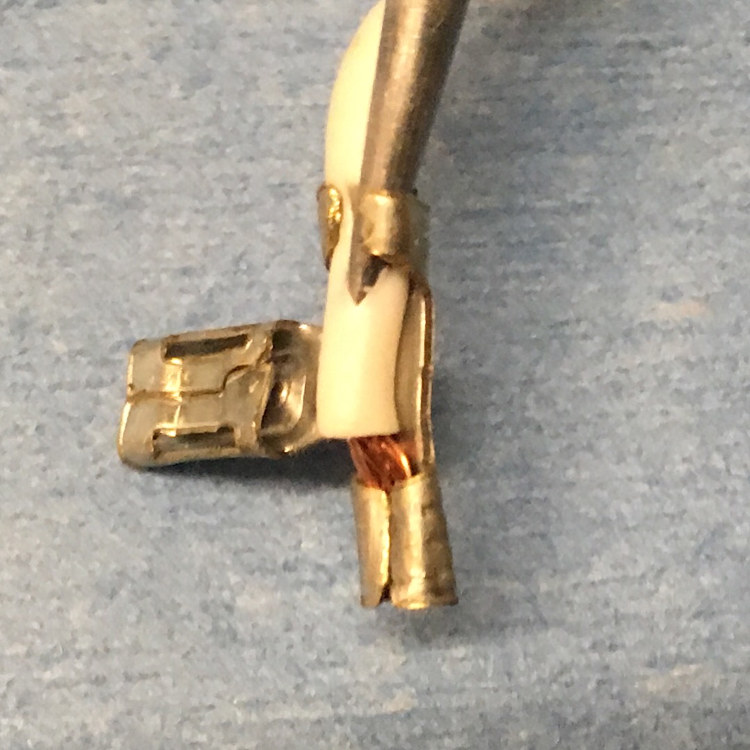 step 22, Using very small fine point punch, pry up connector crimps.